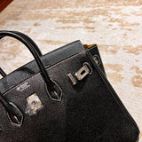 Side view of classic structured handbag