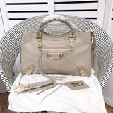 Styled lifestyle shot of everyday-luxe elevated women's handbag – women's luxury accessory