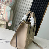  Signature shoulder bag carried on shoulder