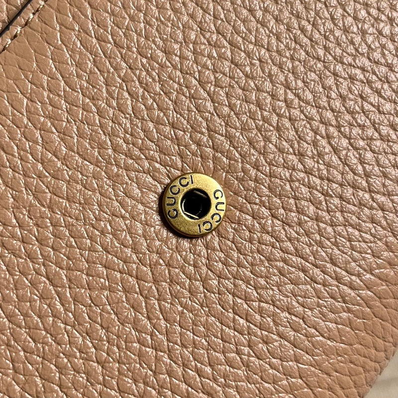 Close-up detail of polished signature women's handbag – women's designer-style accessory
