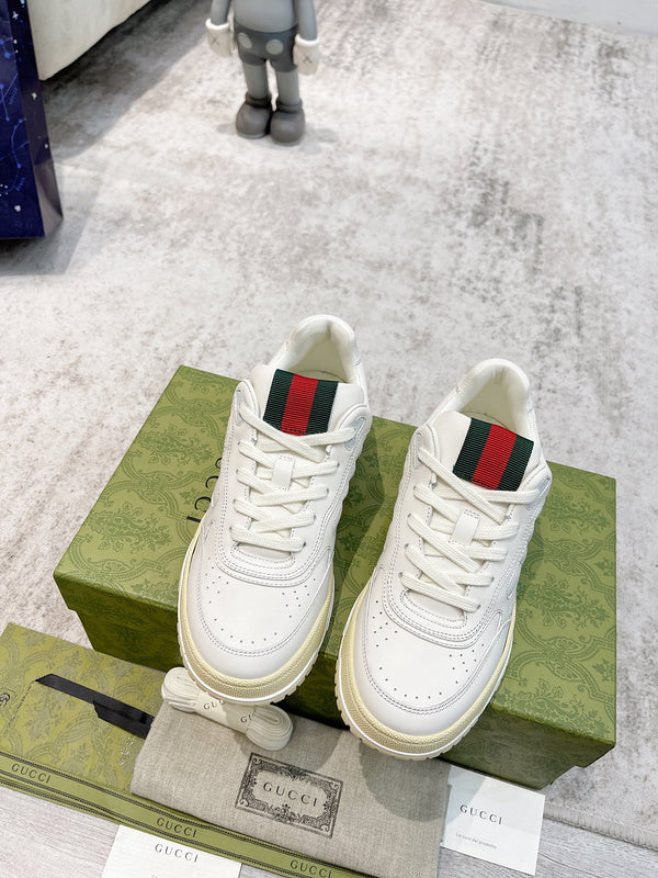 Side profile of Gucci crisp white sneakers heritage-inspired look