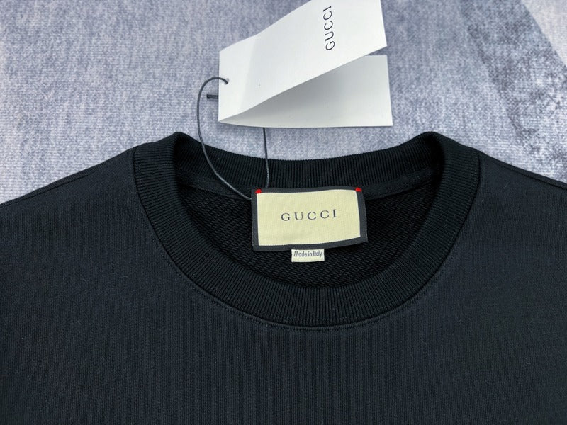 Full styled look of Gucci luxury clothing with signature branding