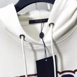 Flat lay presentation of Louis Vuitton luxury clothing with contemporary cut