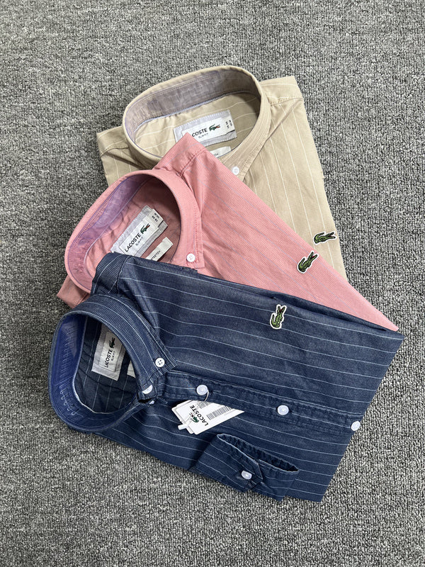 Side profile of Lacoste luxury clothing with monogram-inspired silhouette
