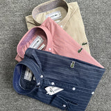 Side profile of Lacoste luxury clothing with monogram-inspired silhouette