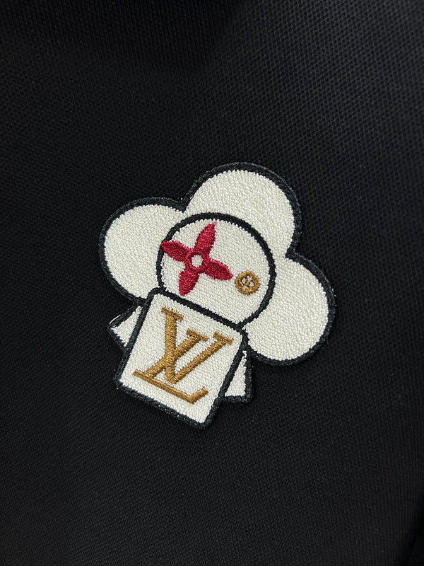Flat lay presentation of Louis Vuitton luxury clothing with label-forward styling