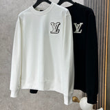 Close-up detail shot of Louis Vuitton luxury clothing with logo-detail design
