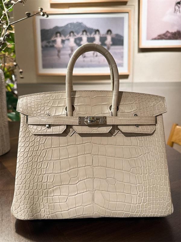  clean-lined crossbody bag detail view showing craftsmanship