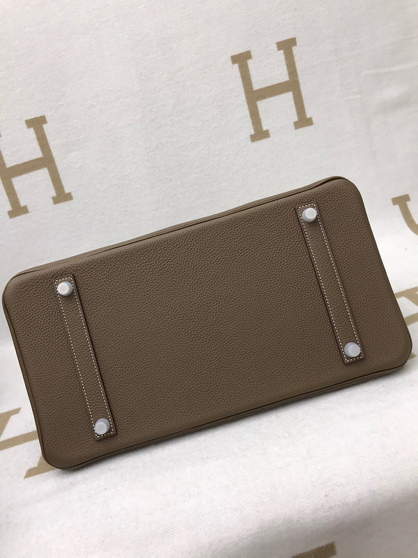 Side view of refined structured handbag