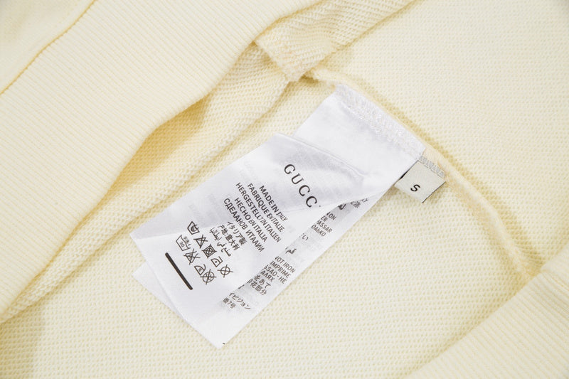 Close-up detail shot of Gucci luxury clothing with relaxed-fit cut