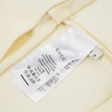 Close-up detail shot of Gucci luxury clothing with relaxed-fit cut