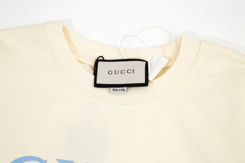 Close-up detail shot of Gucci luxury clothing with relaxed-fit cut