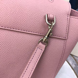 Styled lifestyle shot of modern polished women's handbag – women's luxury accessory