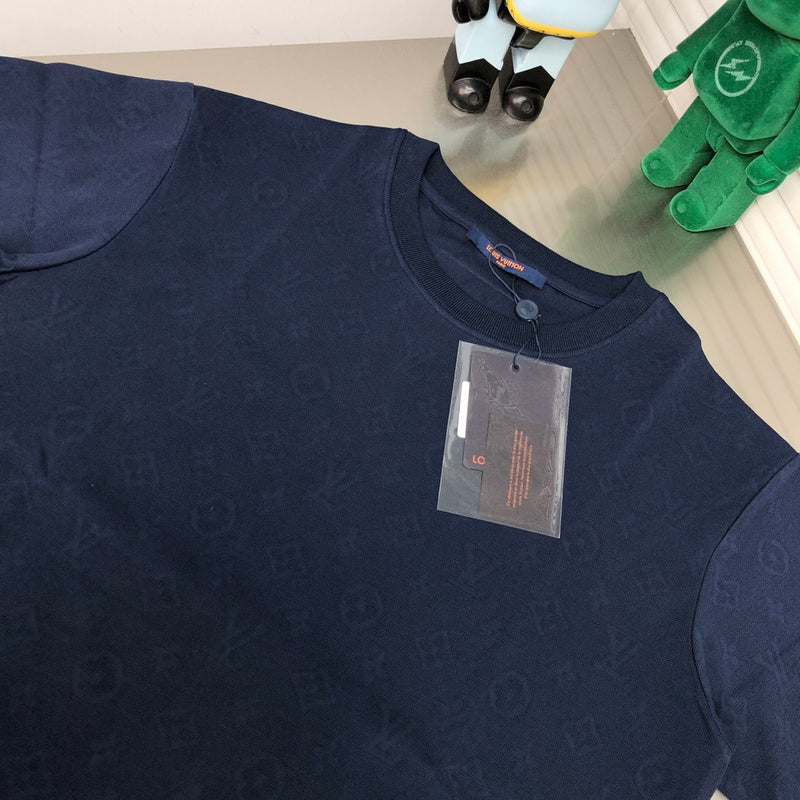 Close-up detail shot of Louis Vuitton cotton t-shirt with label-forward styling