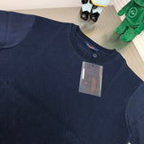 Close-up detail shot of Louis Vuitton cotton t-shirt with label-forward styling
