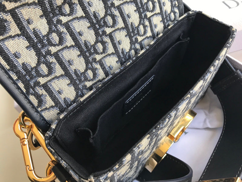 Handle and strap detail of polished signature women's handbag – women's designer-style accessory