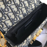 Handle and strap detail of polished signature women's handbag – women's designer-style accessory