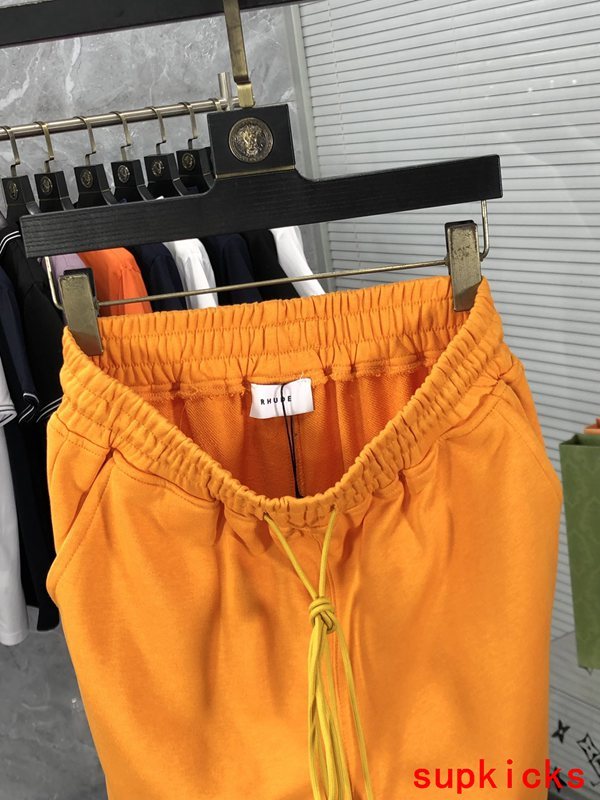 Side profile of Rhude luxury clothing with label-forward styling