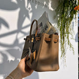 Side view of curated structured handbag