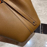 Side view of streamlined structured handbag