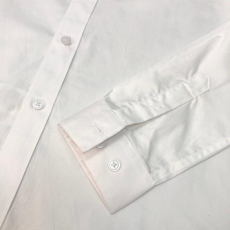 Flat lay presentation of Louis Vuitton luxury clothing with monogram-inspired silhouette