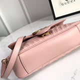 Back view of polished signature women's handbag – women's statement bag