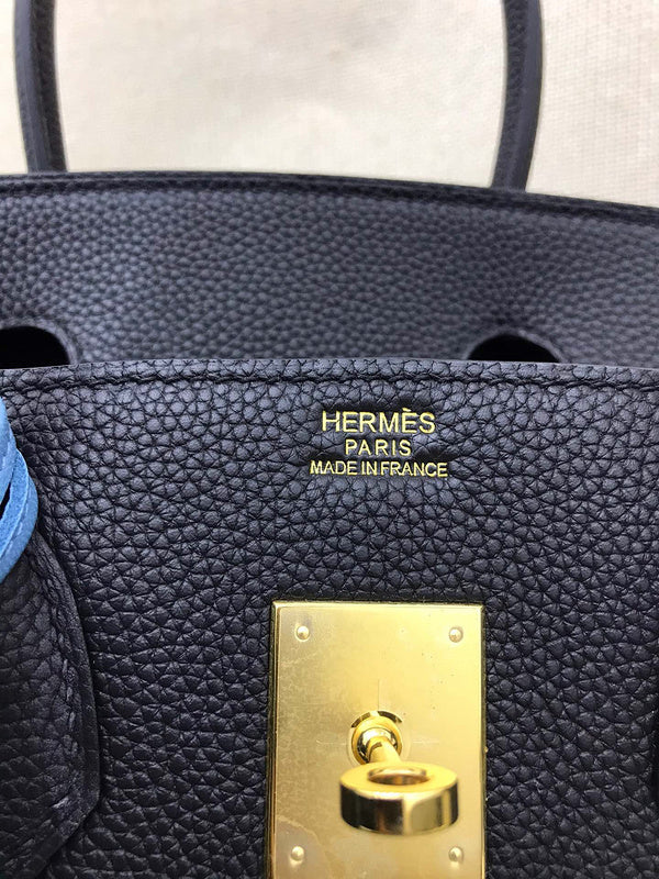 Side view of refined structured handbag