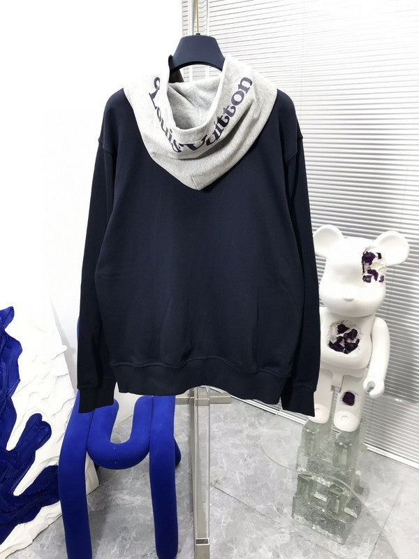 Flat lay presentation of Louis Vuitton luxury clothing with contemporary cut