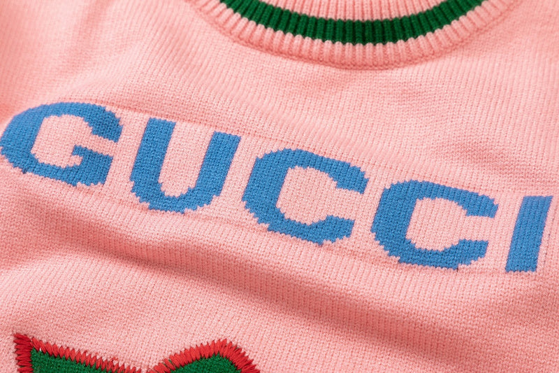 Close-up detail shot of Gucci luxury clothing with logo-detail design
