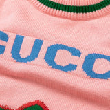 Close-up detail shot of Gucci luxury clothing with logo-detail design