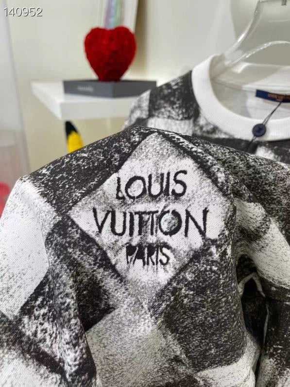 Flat lay presentation of Louis Vuitton luxury clothing with streetwear-inspired cut