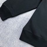 Flat lay presentation of Gucci luxury clothing with signature branding