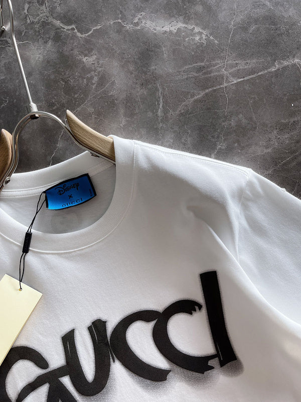 Close-up detail shot of Gucci luxury clothing with monogram-inspired silhouette