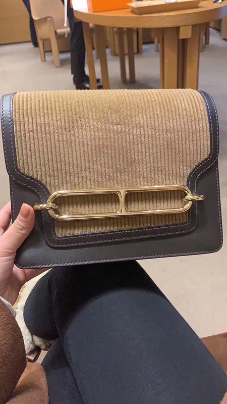 Side view of streamlined structured handbag