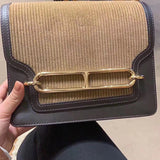 Side view of streamlined structured handbag
