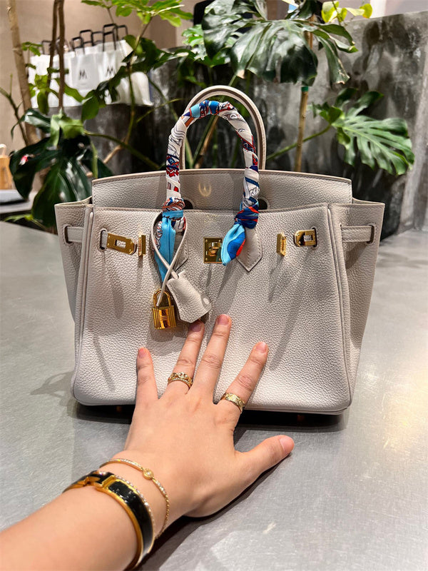 Side view of polished structured handbag