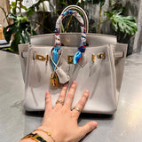 Side view of polished structured handbag
