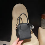 Side view of tailored structured handbag
