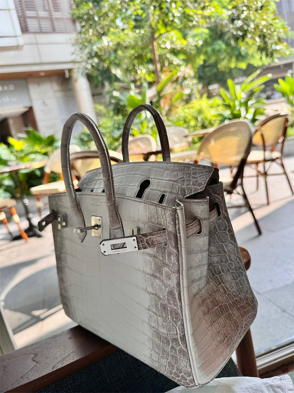  contemporary top-handle bag styled with outfit