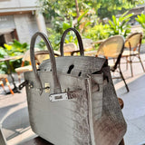  contemporary top-handle bag styled with outfit