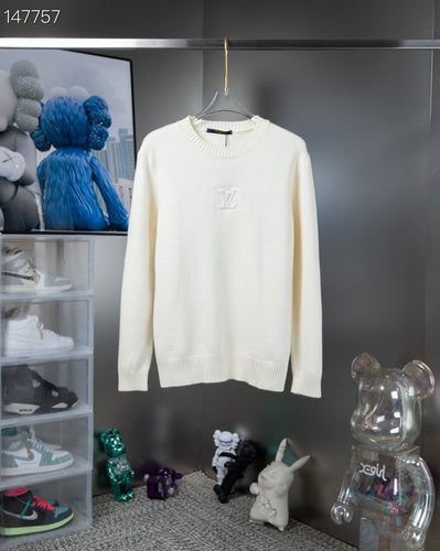 Close-up detail shot of Louis Vuitton luxury clothing with signature branding