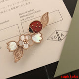 Front view of Van Cleef & Arpels unisex jewelry piece