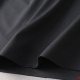 Side profile of Moncler luxury clothing with contemporary cut