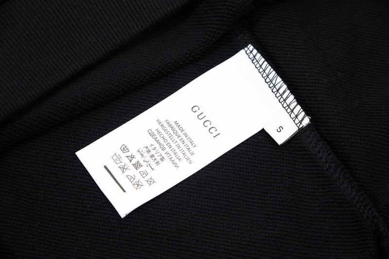 Close-up detail shot of Gucci luxury clothing with relaxed-fit cut