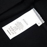 Close-up detail shot of Gucci luxury clothing with relaxed-fit cut