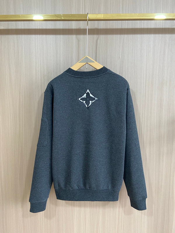 Side profile of Louis Vuitton luxury clothing with label-forward styling