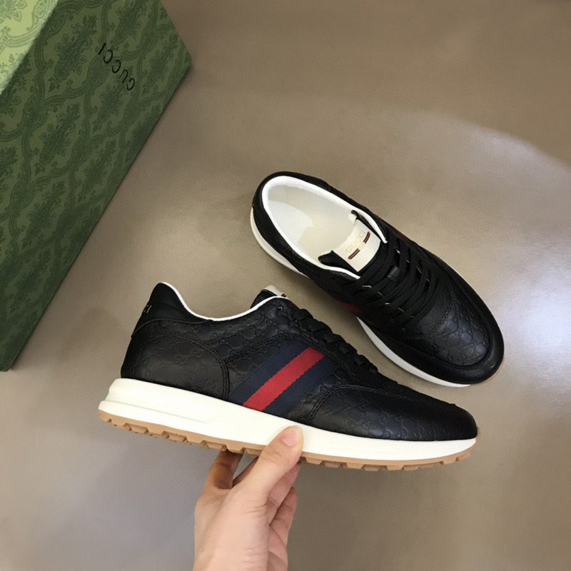 Gucci Designer sneakers in muted earth tones retro runner design front view