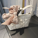 Side profile of elevated refined women's handbag – women's luxury handbag