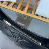 Back view of refined polished women's handbag – women's luxury handbag
