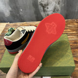 Side profile of Gucci muted earth tones sneakers retro runner design